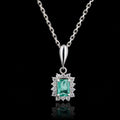 Platinum Emerald & Diamond Halo Pendant Necklace